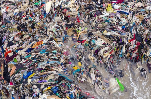 Heaps of unwanted clothes from the UK wash up on Ghana's beaches